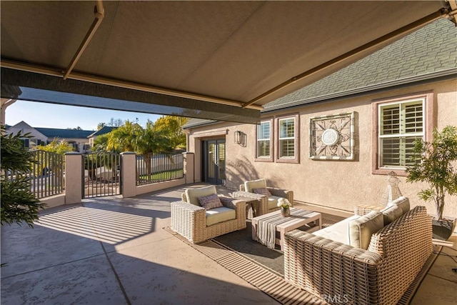 view of patio featuring an outdoor hangout area and fence