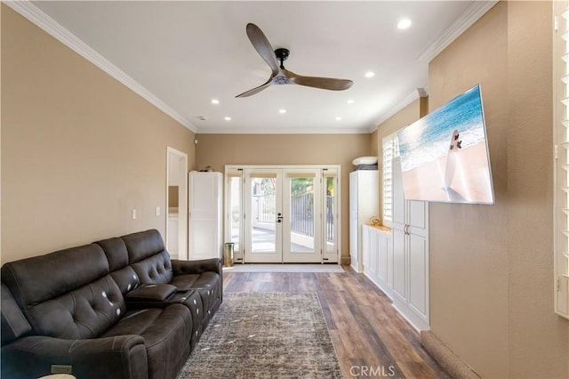 living area with french doors, recessed lighting, wood finished floors, and crown molding