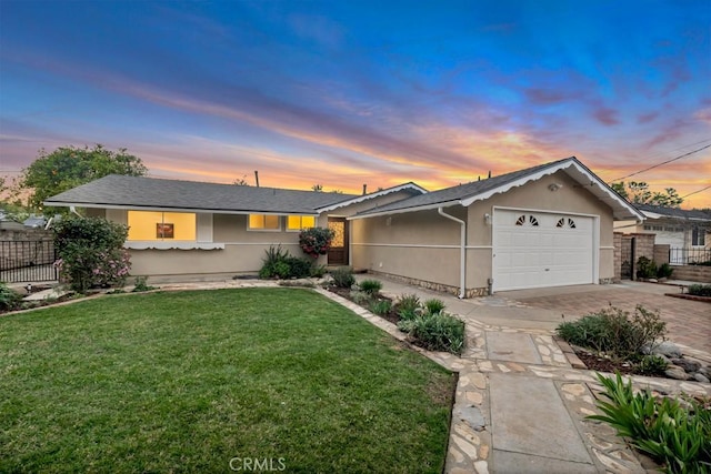 single story home with an attached garage, fence, driveway, stucco siding, and a front lawn