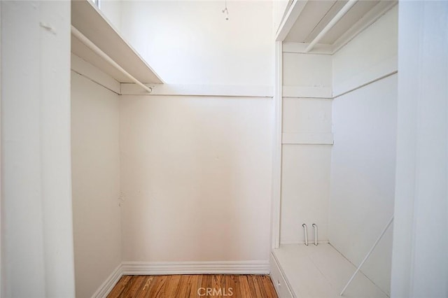 spacious closet with wood finished floors