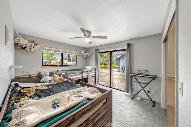 18945 Timber Point Rd, Hidden Valley Lake, CA 95467 - bedroom featuring carpet, a ceiling fan, access to exterior, and multiple windows