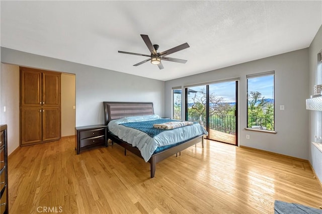 18945 Timber Point Rd, Hidden Valley Lake, CA 95467 - bedroom with ceiling fan, light wood-type flooring, and access to exterior