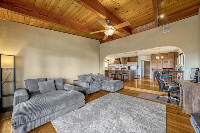 18945 Timber Point Rd, Hidden Valley Lake, CA 95467 - living area with visible vents, light wood-type flooring, beamed ceiling, and arched walkways
