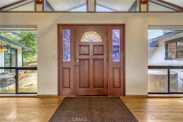 18945 Timber Point Rd, Hidden Valley Lake, CA 95467 - foyer entrance with wood finished floors, a healthy amount of sunlight, and vaulted ceiling