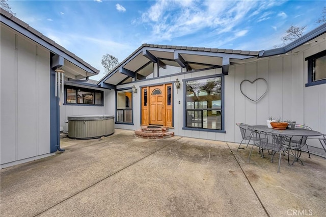 18945 Timber Point Rd, Hidden Valley Lake, CA 95467 - rear view of house featuring a patio area, board and batten siding, and a hot tub