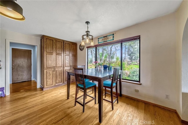 18945 Timber Point Rd, Hidden Valley Lake, CA 95467 - dining area featuring baseboards, an inviting chandelier, and light wood-style floors