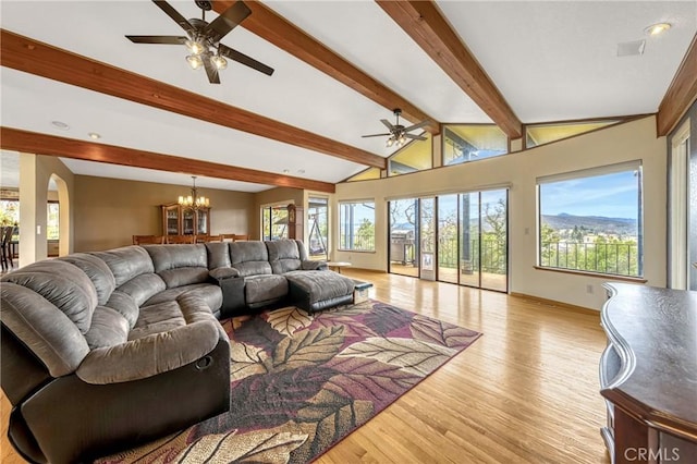 18945 Timber Point Rd, Hidden Valley Lake, CA 95467 - living area featuring baseboards, vaulted ceiling with beams, ceiling fan with notable chandelier, and light wood-style floors