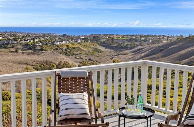 balcony featuring a water view