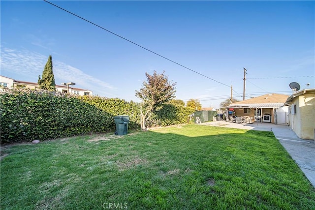 view of yard featuring a patio area and fence