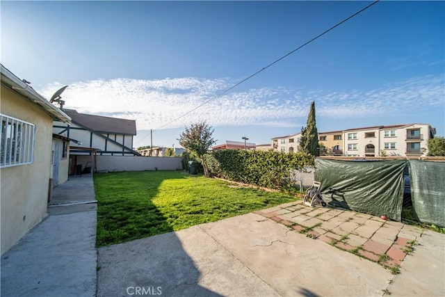 view of yard featuring a patio area and fence