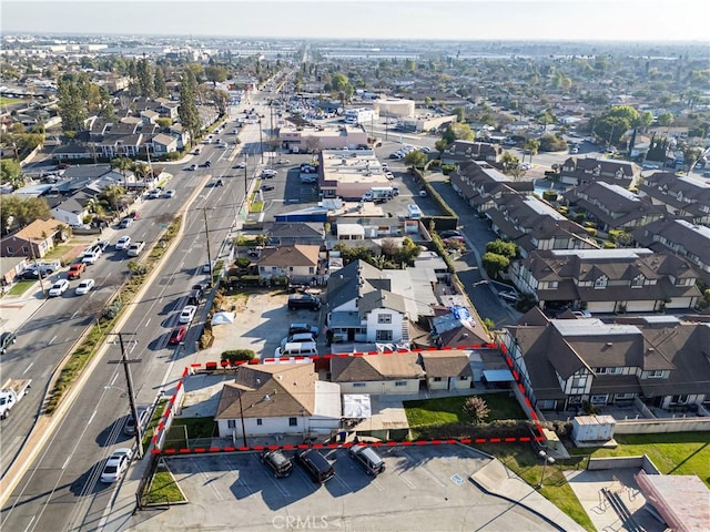birds eye view of property with a residential view