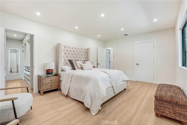 bedroom featuring recessed lighting, visible vents, and light wood finished floors