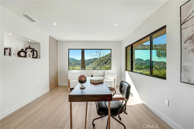 office with recessed lighting, baseboards, visible vents, and light wood finished floors