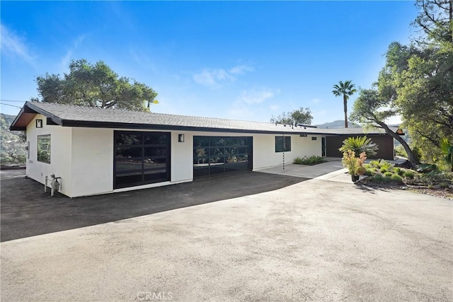 single story home with stucco siding