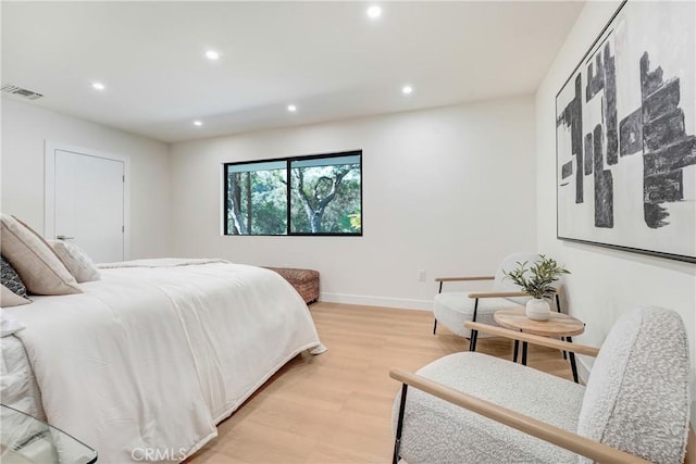 bedroom with recessed lighting, visible vents, light wood-style flooring, and baseboards