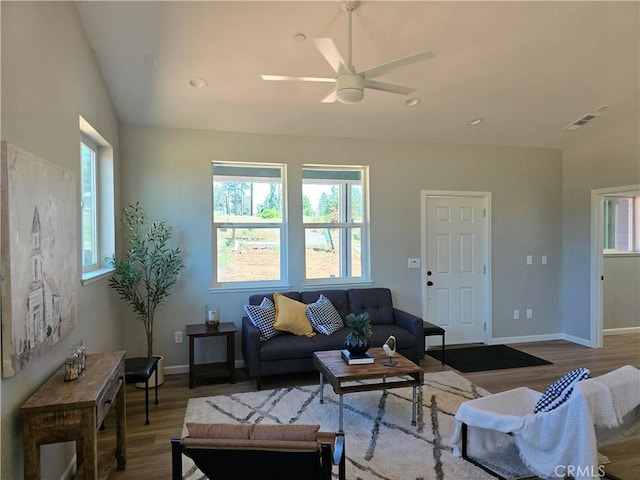 living room featuring recessed lighting, visible vents, baseboards, and wood finished floors