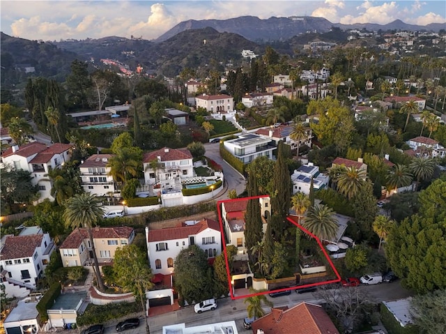 birds eye view of property with a mountain view and a residential view