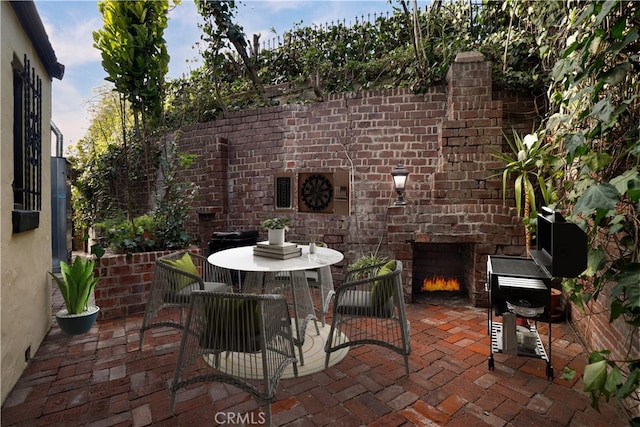 view of patio featuring outdoor dining area