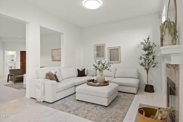 living room featuring a tile fireplace