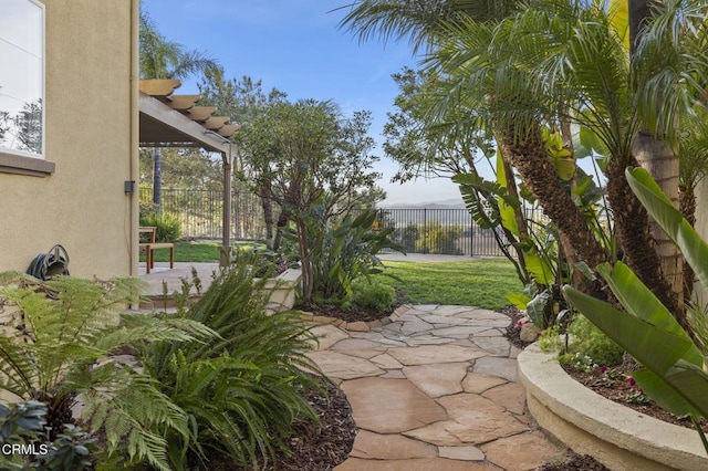 view of patio / terrace featuring fence and a pergola