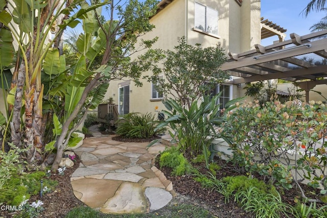 exterior space with a patio area and a pergola