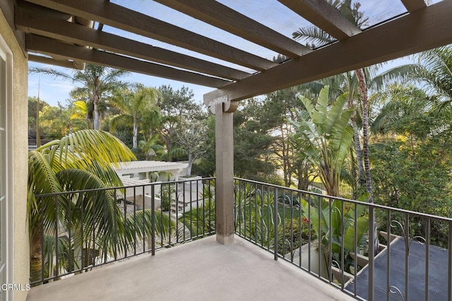 balcony featuring a pergola