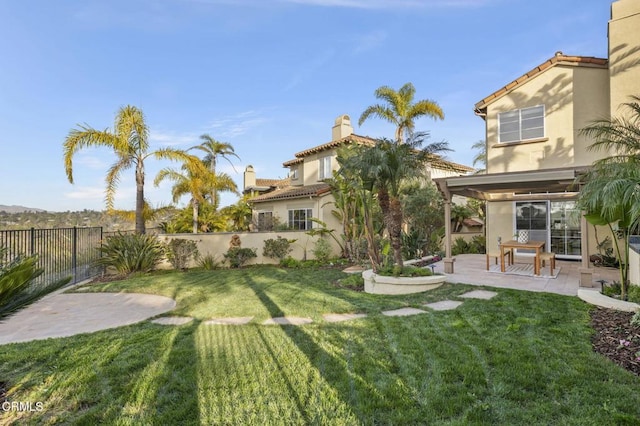 view of yard featuring a patio area and a fenced backyard