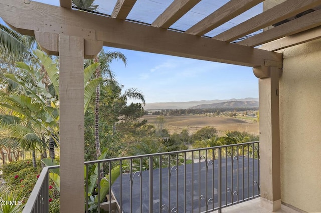 balcony with a mountain view and a rural view