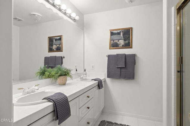 full bath with double vanity, a sink, visible vents, and baseboards