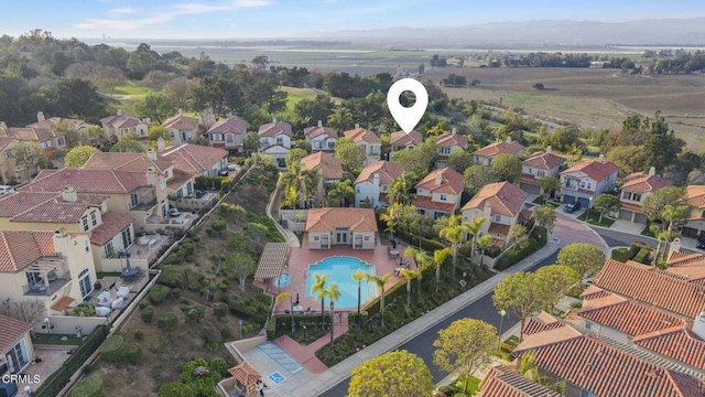 birds eye view of property with a residential view