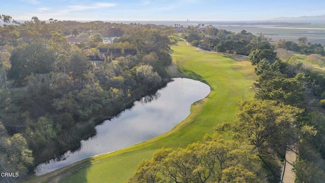 drone / aerial view featuring a water view and view of golf course