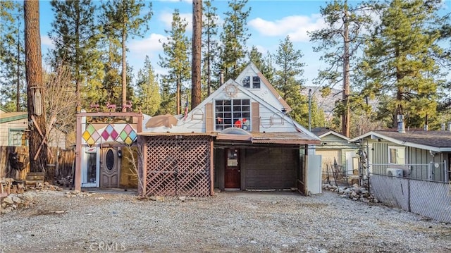 view of front of property featuring fence