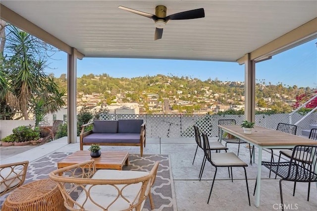 view of patio / terrace with outdoor dining space, ceiling fan, and an outdoor hangout area