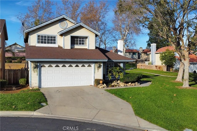 traditional-style home featuring driveway, a garage, fence, and a front lawn