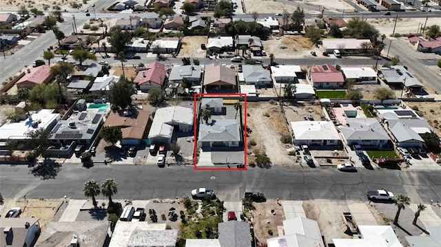 birds eye view of property with a residential view