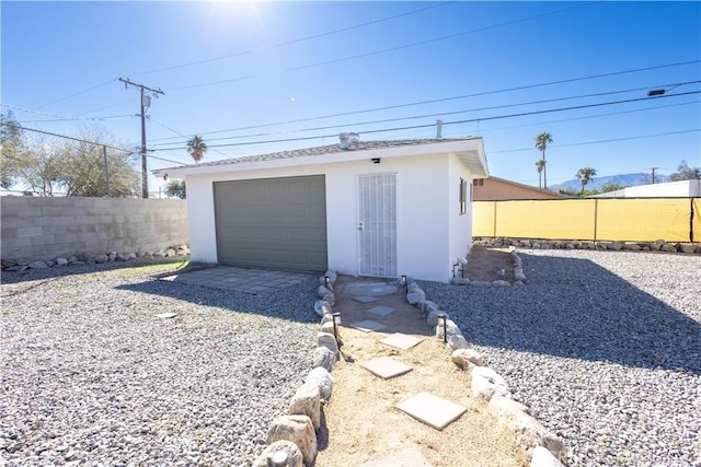 garage with fence