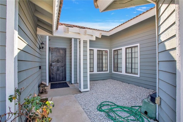 entrance to property with a patio area