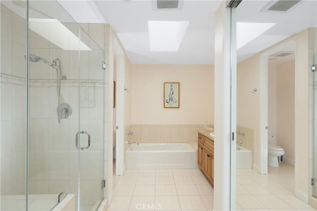 bathroom featuring tile patterned flooring, toilet, a garden tub, visible vents, and vanity