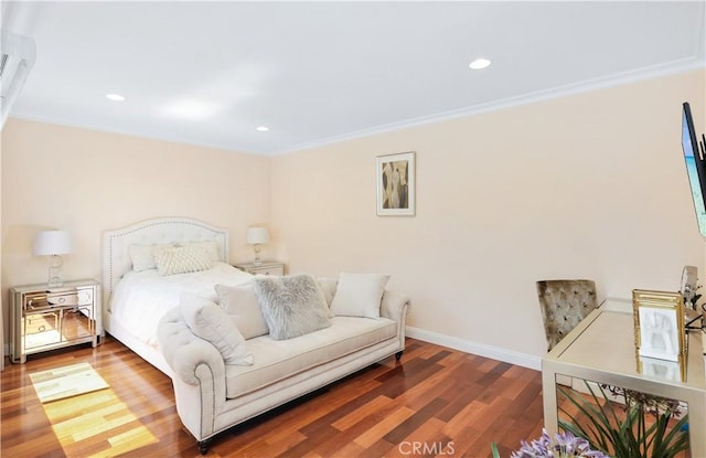 bedroom featuring recessed lighting, crown molding, baseboards, and wood finished floors