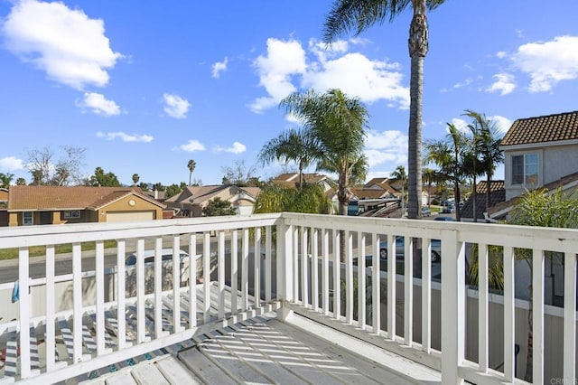 wooden terrace featuring a residential view