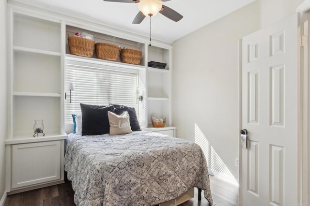 bedroom with dark wood finished floors and a ceiling fan