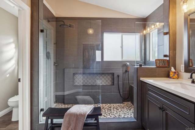 full bath with lofted ceiling, vanity, toilet, and walk in shower