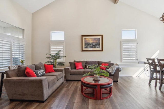 living area featuring baseboards, high vaulted ceiling, and dark wood-style flooring