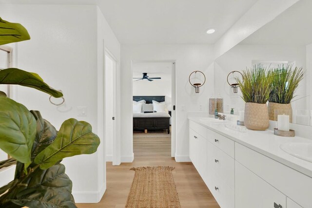 36540 Diego Springs Ave, Murrieta, CA 92563 - ensuite bathroom featuring double vanity, ceiling fan, wood finished floors, a sink, and connected bathroom