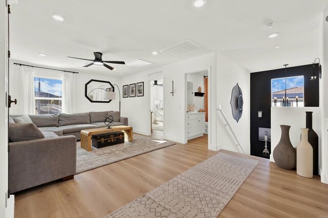 36540 Diego Springs Ave, Murrieta, CA 92563 - living area featuring ceiling fan, visible vents, baseboards, and wood finished floors