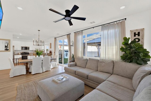 36540 Diego Springs Ave, Murrieta, CA 92563 - living area with light wood-style floors, ceiling fan with notable chandelier, recessed lighting, and visible vents
