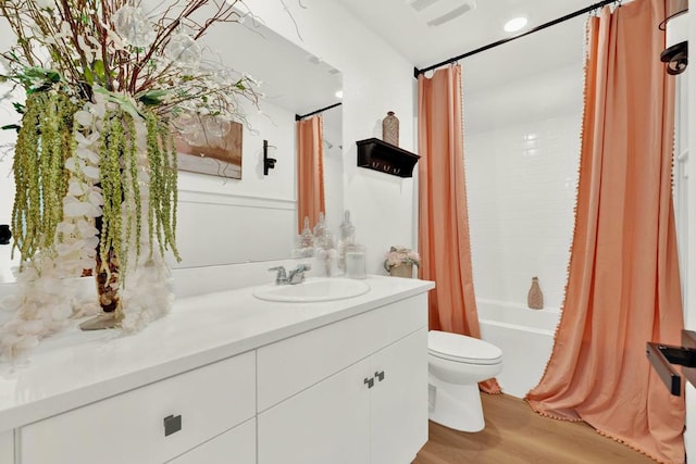 36540 Diego Springs Ave, Murrieta, CA 92563 - bathroom with vanity, toilet, shower / bathtub combination with curtain, wood finished floors, and visible vents