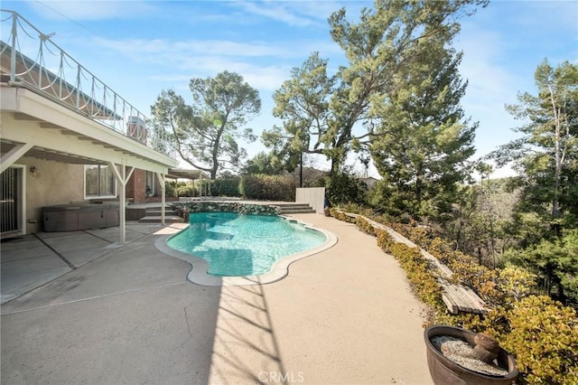 outdoor pool featuring a patio