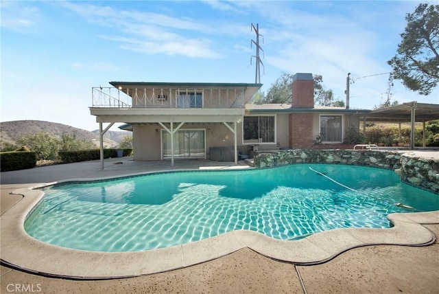 outdoor pool with a patio