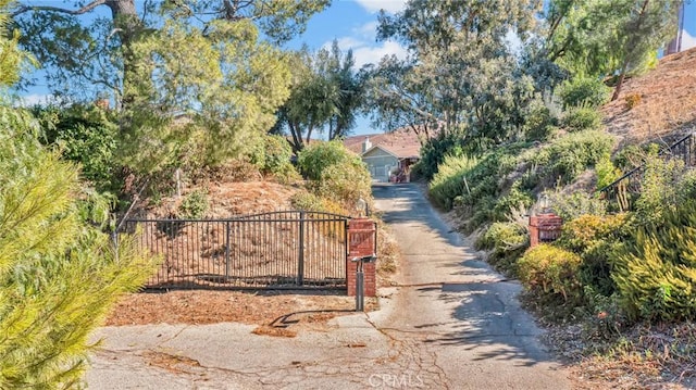 view of gate with fence